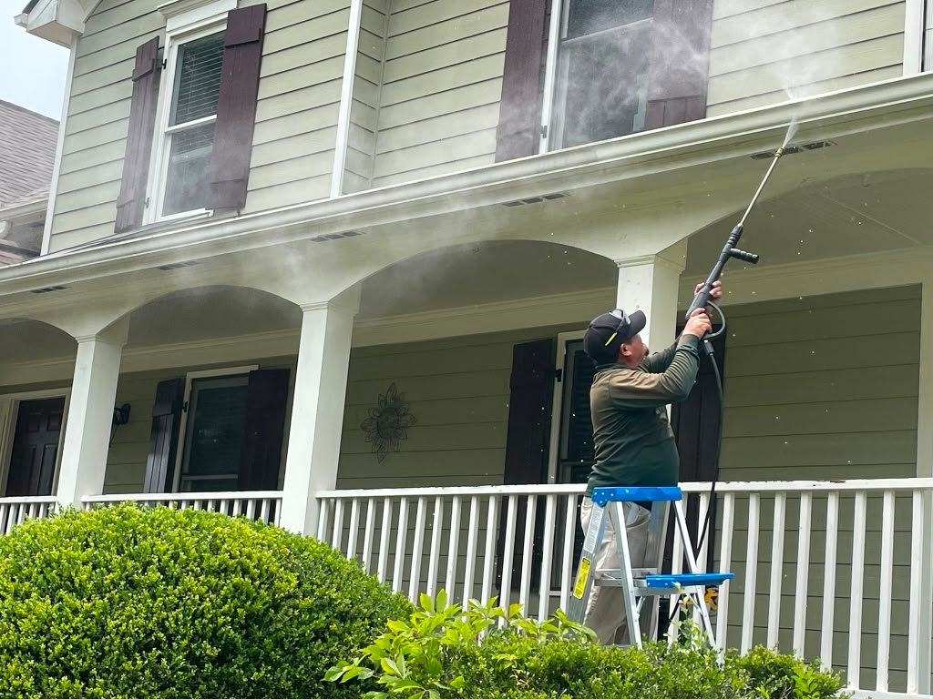 Cleaning visible debris from residential gutters